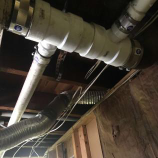 An image of a home’s piping structure on the ceiling
