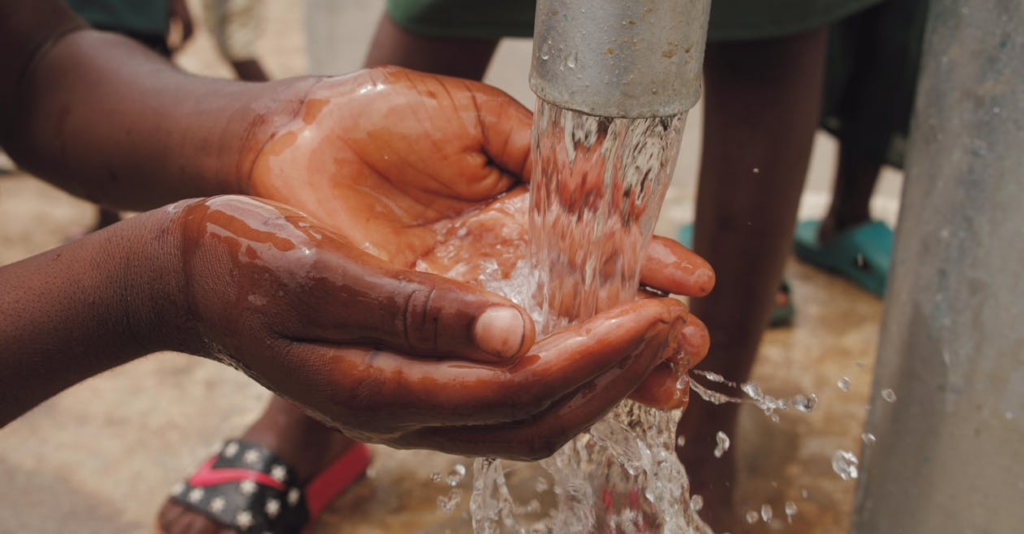 A person using a sump pump for water.