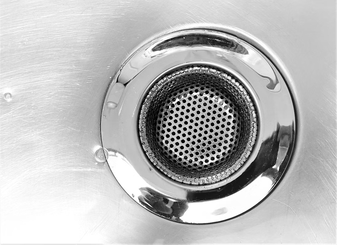 A metal sink drain 