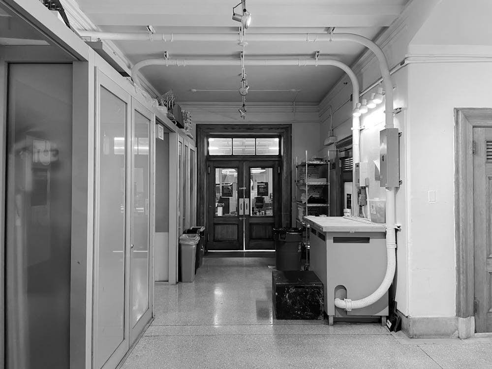 Long empty commercial corridor shown in black and white