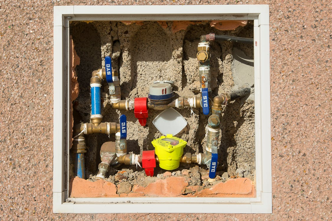 Close-up of water meters installed in a plumbing system