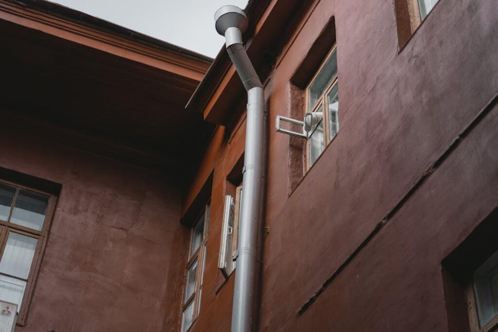 Properly functioning downspouts help prevent outdoor drainage issues by moving rainwater away from the foundation.