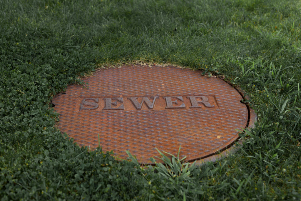 Camera showing manhole before inspecting inside sewer pipe for blockages caption: Real-time sewer line inspection helps remove unwanted clogs