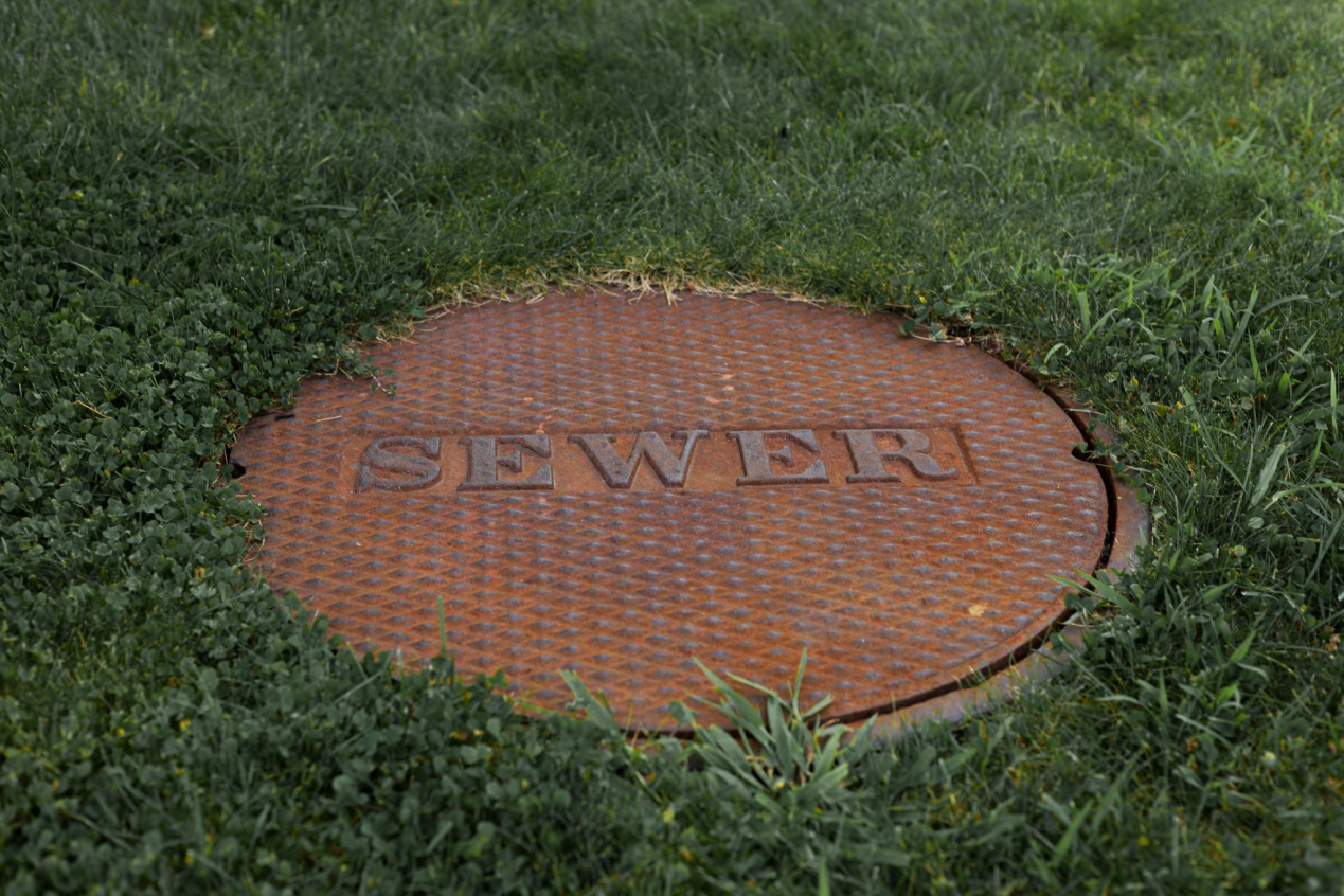 Camera showing manhole before inspecting inside sewer pipe for blockages caption: Real-time sewer line inspection helps remove unwanted clogs