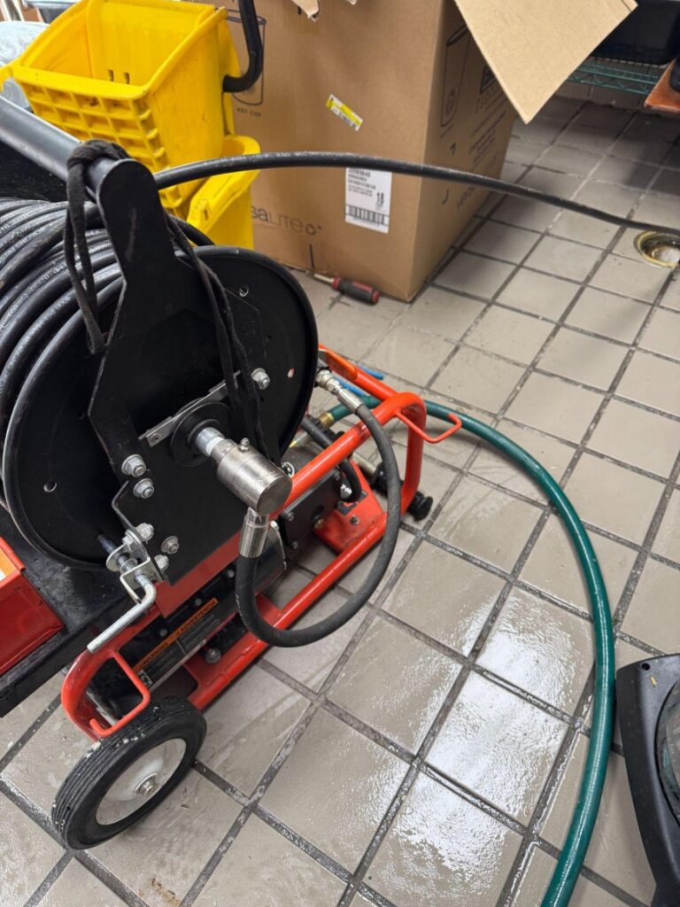 When a drain starts slowing down, most people want the quickest solution. A bottle of chemical drain cleaner promises fast results, while hydro jetting requires professional equipment and service. At first glance, the store-bought option seems like the easier choice. The real question, however, isn't which method works today: It's which one keeps the problem from coming back. If you're comparing hydro jetting vs chemical drain cleaner options, the answer depends on what's happening inside your pipes, not just whether the water starts draining again. A Drain That Flows Isn’t Always a Clean DrainOne of the biggest misconceptions about clogged drains is that restoring water flow means the blockage is gone. In reality, many clogs only develop a small opening that allows water to squeeze through while the majority of the buildup remains attached to the pipe walls. This is why some drains seem "fixed" for a few weeks before slowing down again. The restriction was never fully removed, it simply became passable. When Chemical Drain Cleaners Make SenseChemical drain cleaners can be useful in limited situations. Small amounts of soap residue or hair near the drain opening may break down enough to improve flow temporarily. However, plumbing systems rarely clog because of a single isolated blockage. Kitchen drains often contain layers of hardened grease, food particles, and detergent residue. Bathroom drains accumulate soap buildup, hair, and mineral deposits over time. Main sewer lines may also experience root intrusion or years of sediment accumulation. These are problems that chemicals typically cannot eliminate completely. Hydro Jetting Treats the Entire Pipe, Not Just the ClogInstead of targeting one section of the blockage, hydro jetting services help clean the full interior of the pipe using highly pressurized water. Think of the difference like washing a dirty driveway. Spraying a narrow path through the dirt allows you to walk across it, but the driveway is still dirty. Pressure washing the entire surface removes the buildup from edge to edge. Hydro jetting works the same way. It clears accumulated grease, sludge, soap residue, scale, and loose debris from the pipe walls, helping restore the pipe's original flow capacity. https://drive.google.com/drive/folders/1m_WkeHrueKsbDz85921aKkPlg21E_Jz3 File Name: professional-hydro-jetting-equipment Alt Text: Professional hydro jetting machine prepared for sewer cleaning Caption: Specialized hydro jetting equipment provides deep pipe cleaning. Which Option Delivers Better Long-Term Value?A bottle of drain cleaner may cost less upfront, but recurring clogs often mean buying the same product repeatedly while the underlying restriction continues to grow. Hydro jetting typically requires a higher initial investment, yet it addresses the source of recurring drainage problems instead of masking the symptoms. For properties that experience repeated slow drains or backups, this often reduces future service calls and emergency repairs. Looking beyond the immediate price tag can save considerably more over the life of the plumbing system. It’s Not Just About Effectiveness, It’s Also About the Condition of Your PipesEvery plumbing system is different. Older pipes, commercial plumbing systems, and sewer lines with years of buildup benefit from an accurate diagnosis before any cleaning method is chosen. Professional plumbers often begin with a camera inspection to determine the type of blockage, its location, and the overall condition of the pipe. That information helps identify whether hydro jetting is the right solution or whether another repair is needed. Making that decision based on the actual condition of the plumbing is far more effective than relying on trial and error. Choose a Solution That LastsRecurring drain problems are usually a sign that buildup is developing throughout the pipe—not just at the point where water stops flowing. Addressing the entire system instead of treating the symptom helps improve drainage performance and reduces the likelihood of repeated clogs. J&B Drain Cleaning and Plumbing Service provides professional hydro jetting, drain cleaning, and sewer inspection services for residential and commercial properties throughout Long Island. If you're tired of clearing the same drain repeatedly, schedule a professional evaluation and discover the most effective long-term solution for your plumbing system.
