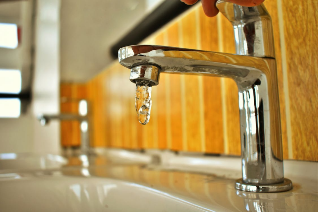 A tap with leaking with water. 