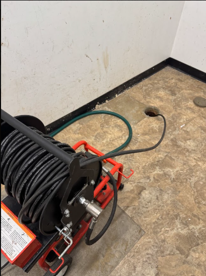 A cable machine fed into a floor cleanout to reach a blockage well beyond the trap.Client Image: IMG_16474.jpeg