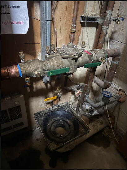 A valve manifold on an older service, the kind that seizes if it is never exercised.