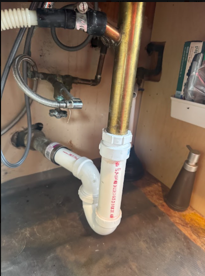 A supply riser and valve set, checked early when a leak has no visible source.